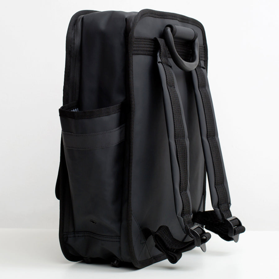 Matt black boxy backpack with outside side pockets and two front velcro pcokets and one zip pocket. Laptop pocket and waterproof material. Monochrome rucksack Goodordering