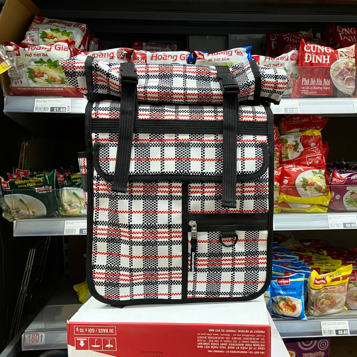 Tartan rolltop cycling bag with backpack straps and pannier attachment